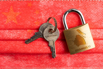 Shanghai lockdown: a lock with a Shanghai map and the word lockdown engraved on a pair of key over...