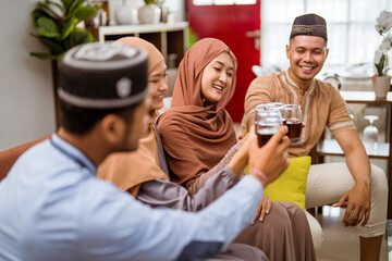 friend muslim cheering their glass celebrating eid mubarak together