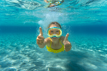 Underwater portrait of child in the sea