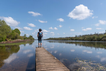 Woman on the jetty. Aureilhan pond. Mimizan. Landes