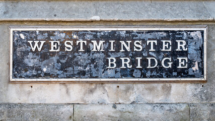 Old street sign on Westminster Bridge, london. The bridge opened in 1862 and spans the River Thames