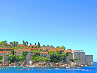 Fototapeta na wymiar Sveti Stefan, small islet and resort in Montenegro. Balkans, Adriatic sea, Europe. Beauty world.