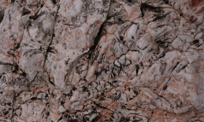 Raw marble stone. Dark coral and gray colors.