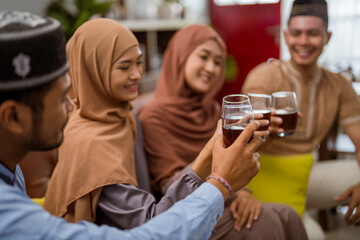 friend muslim cheering their glass celebrating eid mubarak together