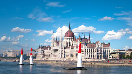 contrail of sport aircraft race at the airshow in front of the parlament in Budapest above Danube