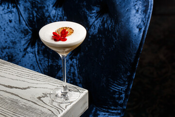 Coffee cocktails and liquor on blue reflective background. Copy space for your text.