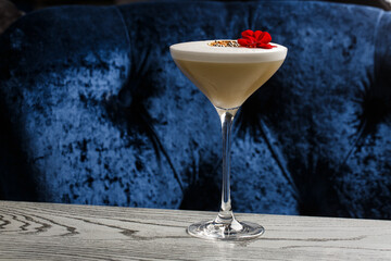 Coffee cocktails and liquor on blue reflective background. Copy space for your text.