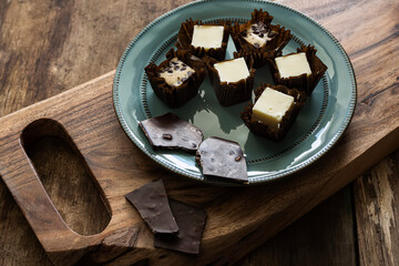 Delicate cottage cheese desserts and chocolate. Dark style. soft selective focus with shallow depth of field

