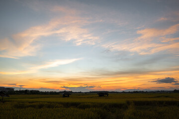 Colorful sunset and sunrise with clouds. Blue and orange color of nature. Many white clouds in the blue sky. The weather is clear today. sunset in the clouds. The sky is twilight.