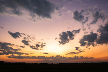 Colorful sunset and sunrise with clouds. Blue and orange color of nature. Many white clouds in the blue sky. The weather is clear today. sunset in the clouds. The sky is twilight