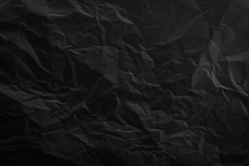 Black crumpled paper background