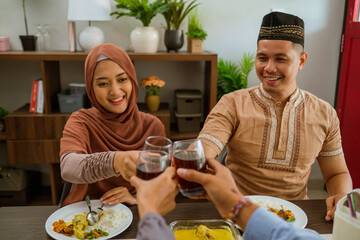 friend muslim cheering their glass celebrating eid mubarak together