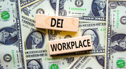 Fototapeta na wymiar DEI diversity equity inclusion workplace symbol. Blocks with words DEI workplace on beautiful background from dollar bills. Business DEI diversity equity inclusion workplace concept. Copy space.