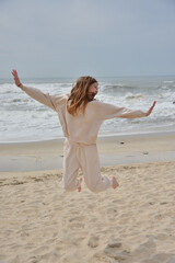 Fototapeta na wymiar young girl happy on the beach ocean