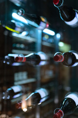 Bottle with wine on a glass showcase