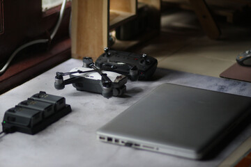 Modern drone and laptop on the table