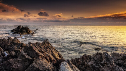 Fototapeta premium Sunrise at the Coast of Sicily at Capo Gallo, Mondello in spring Italy at the morning sea in Europe