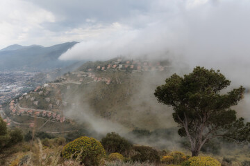 Sicilian Italian Coastal Hill Landscape near Palermo in Europe, on a foggy cloudy spring day
