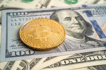 Gold bitcoin on US dollar banknotes for electronic worldwide exchange virtual money, blockchain, cryptocurrency