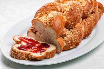Czech Christmas pie called vanocka with strawberry marmelade