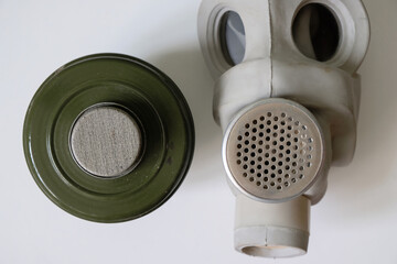 Old gas mask on a gray background. 