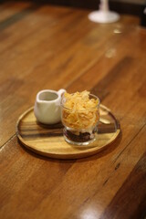 Closeup of Iced Caramel Macchiato at the coffee shop, Caramel Macchiato is a classic macchiato beverage. It consists of vanilla syrup, espresso, steamed milk, foam, and caramel drizzle