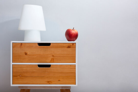 Side table with apple and lamp