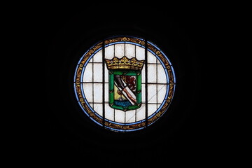 Guimar, Tenerife, Canary Islands, Spain, March 8, 2022: Round stained glass window with a coat of arms inside the church of Sant Peter in Guimar, Tenerife. Spain