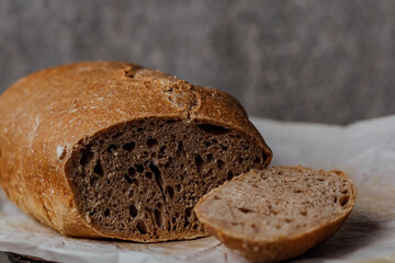 Fresh homemade sourdough bread on a rustic background with copy space.
