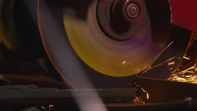 close-up, cutting of metal structures, making homemade armor plate by professional worker using a cutting machine. cutting work with smooth equipment for steel metal, iron, sparks in a heavy industry