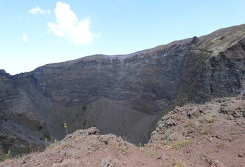 Fototapeta na wymiar Large crater with lava in the top of the Vesuvius volcano near Naples in Southern Italy