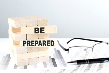 BE PREPARED is written on wooden blocks on a chart background