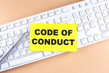 Text CODE OF CONDUCT text on a sticky on keyboard, business concept