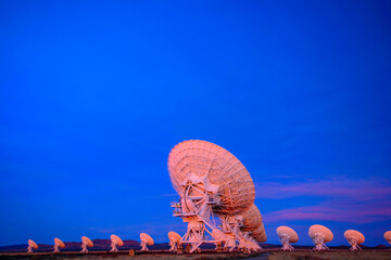 Array of satellites, VLA with sunset light