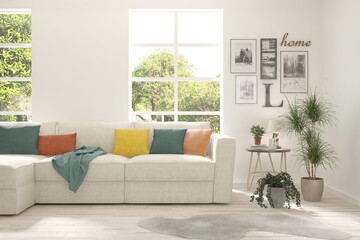White living room with sofa and summer landscape in window. Scandinavian interior design. 3D illustration