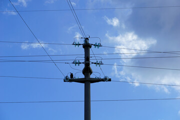 Power line pole with wires that conduct electricity