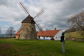 Naklejka na ściany i meble Kuzelov, Czech Republic - April 16, 2022 - The Old Windmill - a national cultural monument at the beginning of spring