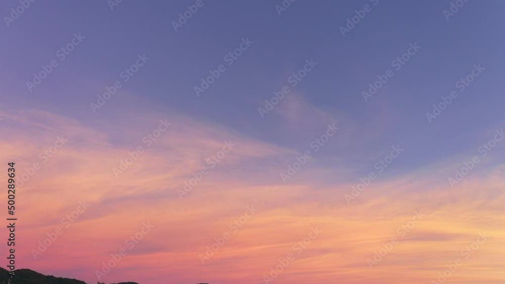 Wall mural aerial view sweet sky in sunset above the mountain range at karon beach phuket. abstract nature back