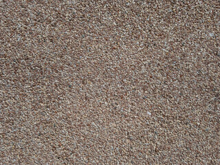 Brown stone chips, exterior finish texture