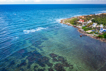 Fototapeta na wymiar Aerial view of the Akumal Bay in Quintana Roo, Mexico. Caribbean Sea, coral reef, top view. Beautiful tropical paradise beach