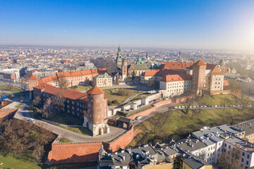 Aerial view to Wawel castle on the hill. Beautiful morning sunrise. City panaramic drone view from above. Poland Krakow famous tourist historical attractions