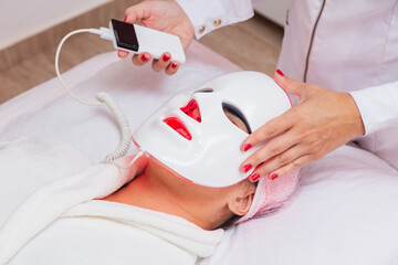 Use of led mask on patient for aesthetic treatment, relaxation, rejuvenation, color therapy, light...