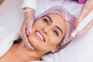 close-up of facial plasma jet on patient, Application of aesthetic procedure, rejuvenation.