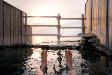 Open air hot spring bath (onsen) overlooking the sunset and pacific ocean at Sawada park open-air...