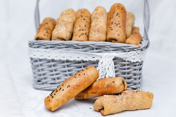 buns pies stuffed in a wicker basket