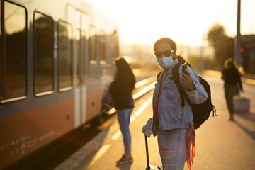 A young man with baggage ready to travel.