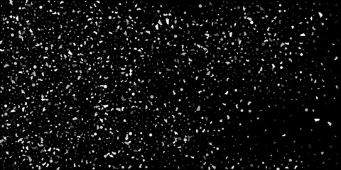 Silver grainy abstract texture overflows against a black background. Element of design.