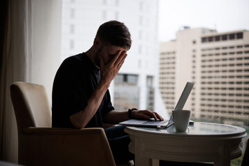 Burnout from work. Information overload. Fatigue from work at home. Tired businessman having a...