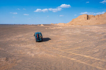 Campervan 4x4 in the middle of desert of Iran