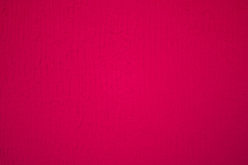 Burgundy background, with a texture of facade plaster